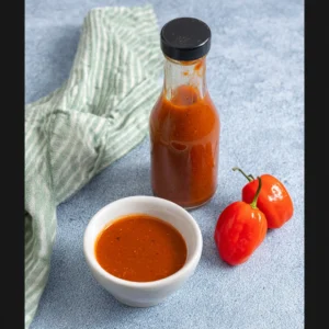 Habanero Chilli Sauce Recipe: A Fiery Tribute to My Culinary Roots 2 Homemade habanero chilli sauce recipe in glass bottle