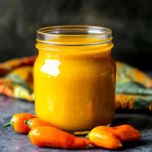 Mango Habanero Sauce Recipe: The Ultimate Sweet and Spicy Homemade Sauce 2 mango habanero sauce recipe in glass jar with fresh mango and habaneros